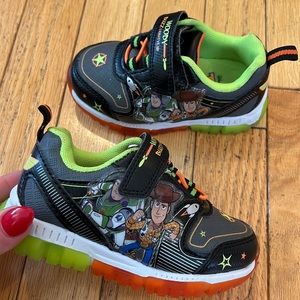 NWOT Toddler size 6 Toy Story light up sneakers with velcro.